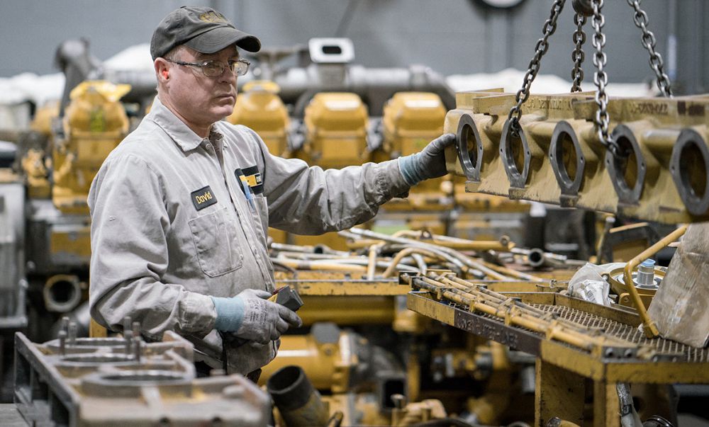 Carter Technician working on engine